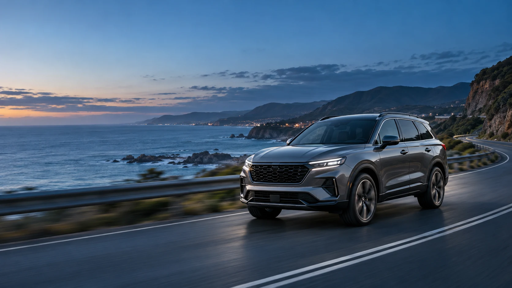 A graphite SUV travelling along a coastal road at dusk